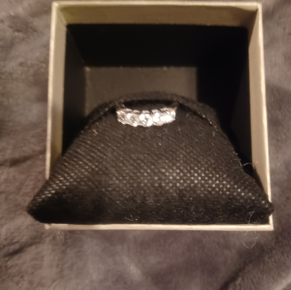 Rhodium over 925 sterling silver ring. Cubic Zirconia 5 stones band ring.Size 7.